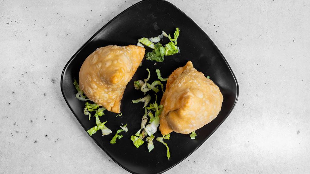 Vegetable Samosas · Warm crispy stuffed pastries of potatoes and green peas blended with Indian spices. Perhaps the most popular stuffed pastry from the east.