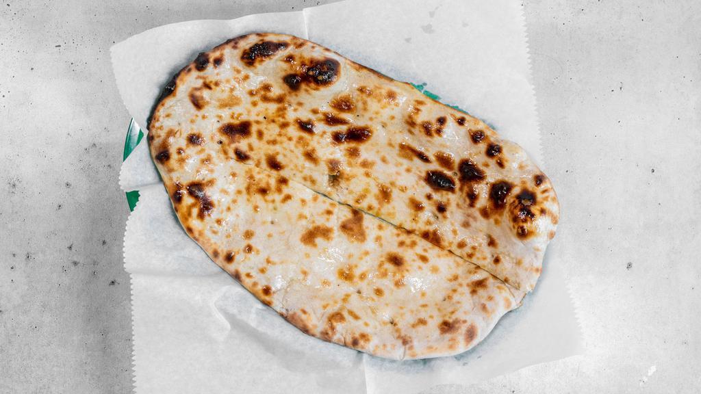 Naan · Leavened flatbread made from white flour baked in our tandoor. South Asia's most popular bread.