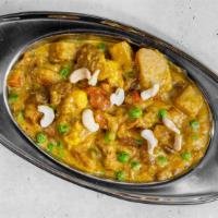 Vegetable Korma · Mix of fresh vegetables prepared with homemade cheese and garnished with cashews and raisins...