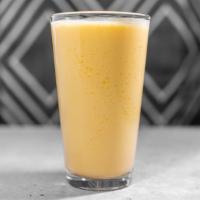 Mango Lassi · A traditional drink of mango purée and homemade yogurt.