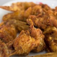 Fried Chicken Wings · Six seasoned, deep-fried wings bathed in our sweet and hot sauce.