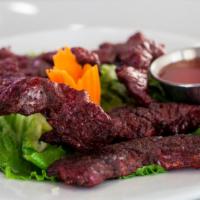 Thai Style Beef Jerky · Beef tenderloin marinated in Thai spices and dried over slow heat.