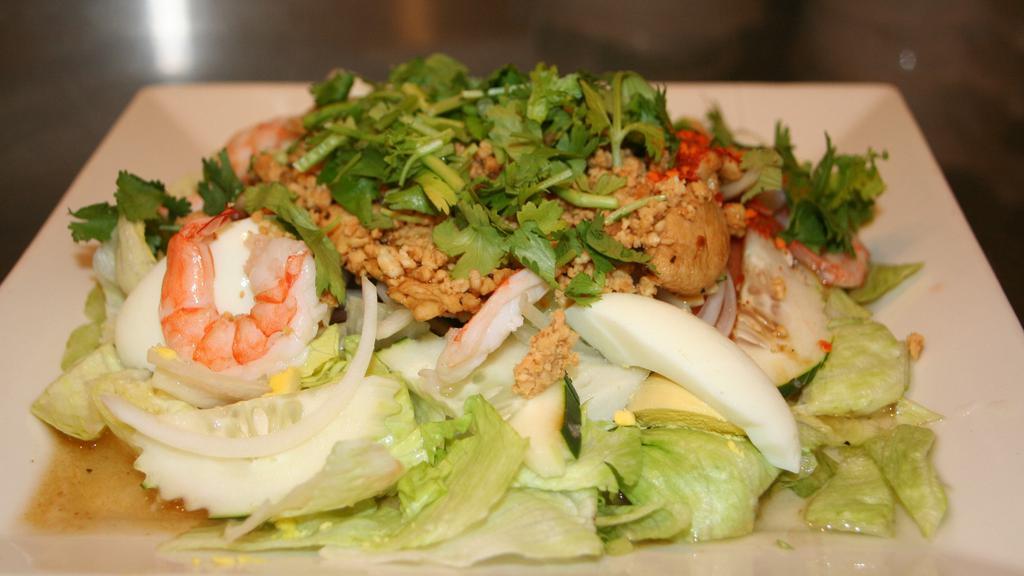Yum Yai Thai Salad · Gluten-free. Thai version of ‘chef salad. ’ crisp vegetables, sliced hard-boiled egg, shrimp, and chicken. Tossed in a peanut vinaigrette.