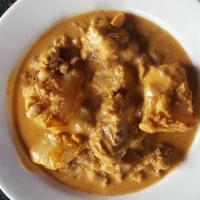 Massamun Curry · Tender meat simmered in a tasty curry with potatoes and peanuts.
