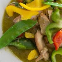 Green Curry · Spicy, favorite. Simmered in coconut milk with sweet peas and bell peppers.
