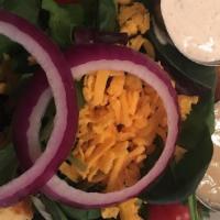 Star House Salad · Mixed greens with shredded Cheddar, cherry tomatoes, red onions, and cornbread croutons and ...
