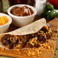 Combo Taco Dinner · Juicy beef, steak, and chicken taco with cheese, tomatoes, lettuce, and sour cream with your...