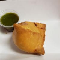 Samosa · A triangular savory pastry fried in oil, containing spiced potato and peas.
2 per order