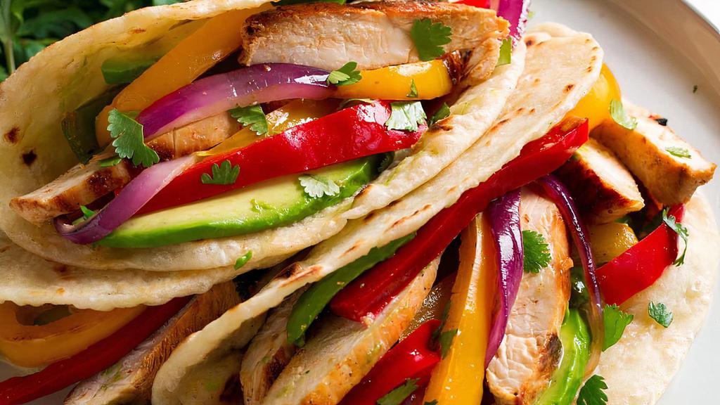 Chicken Or Beef Fajita · Choice of meat (chicken or beef), peppers, onions, with rice, beans, lettuce, onions, tomatoes, and avocado.