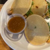 Gordita Combo · Three thick hand made gorditas stuffed with refried beans, choice of meat, onions, salsa and...