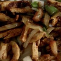 Chicken Fajitas · A sizzling plate with grilled onions, bell peppers, and chicken.