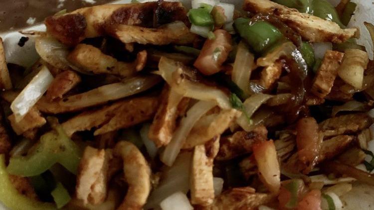 Chicken Fajitas · A sizzling plate with grilled onions, bell peppers, and chicken.