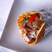 Gyros · Beef, and lamb layers, lettuce tomato, onion, Feta cheese, and tzatziki sauce in pita bread....