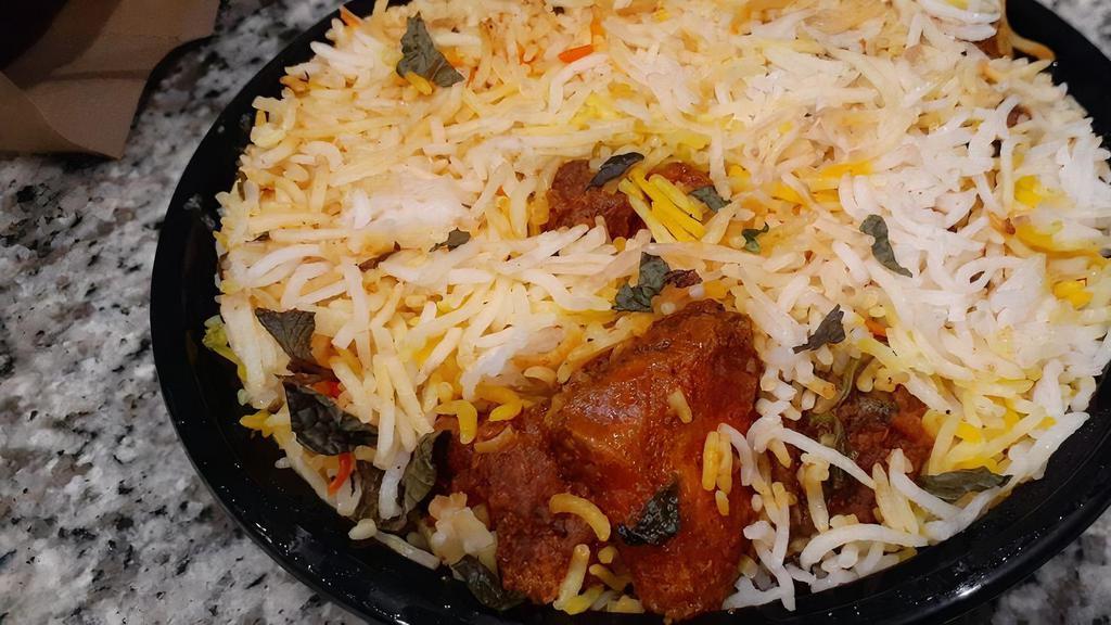 Biryani · Your choice of protein mixed with seasoned long grain basmati rice and topped with crispy fried onions and cashew nuts. Chicken | Lamb | Shrimp | Vegetable (vegetarian).