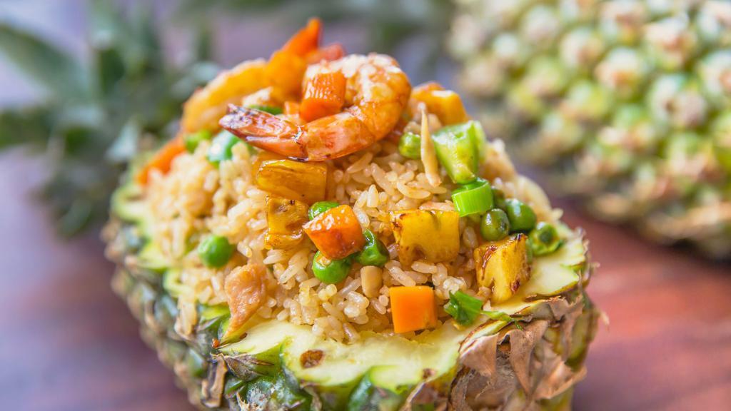 Tropical Fried Rice · Egg, cashew nuts, pineapple, raisin, onions, scallions, and curry powder.