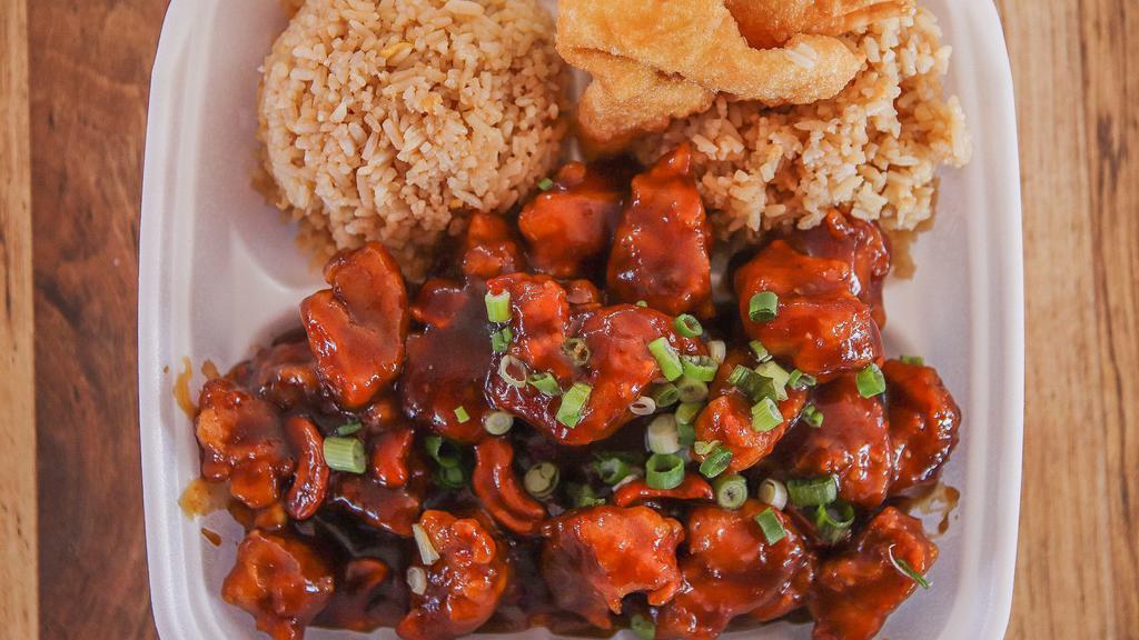 Spring Field Chicken  · Deep fried chicken with some cashew nuts and a sprinkle of chopped green onions on top. Served with rice and one Crab Rangoon.