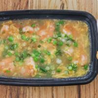 Shrimp Lobster Sauce  · It has shrimp, peas, eggs, and onions in white sauce.
Served with rice and one Crab Rangoon