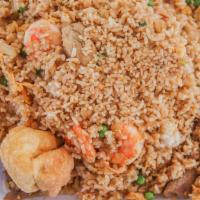 Combo Fried Rice · Fried rice with shrimp, beef, chicken, onions, peas, and eggs. 
Served with one crab rangoon...