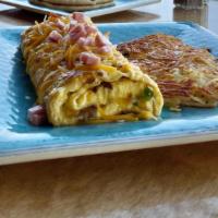 Denver Omelet · Made with mushrooms, ham, onions, bell peppers and topped with cheddar and monterey jack che...