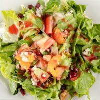 Michigan Cherry Salad · Greens, feta cheese, grapes, apples, dried cranberries & cherries, Mandarins & walnuts serve...