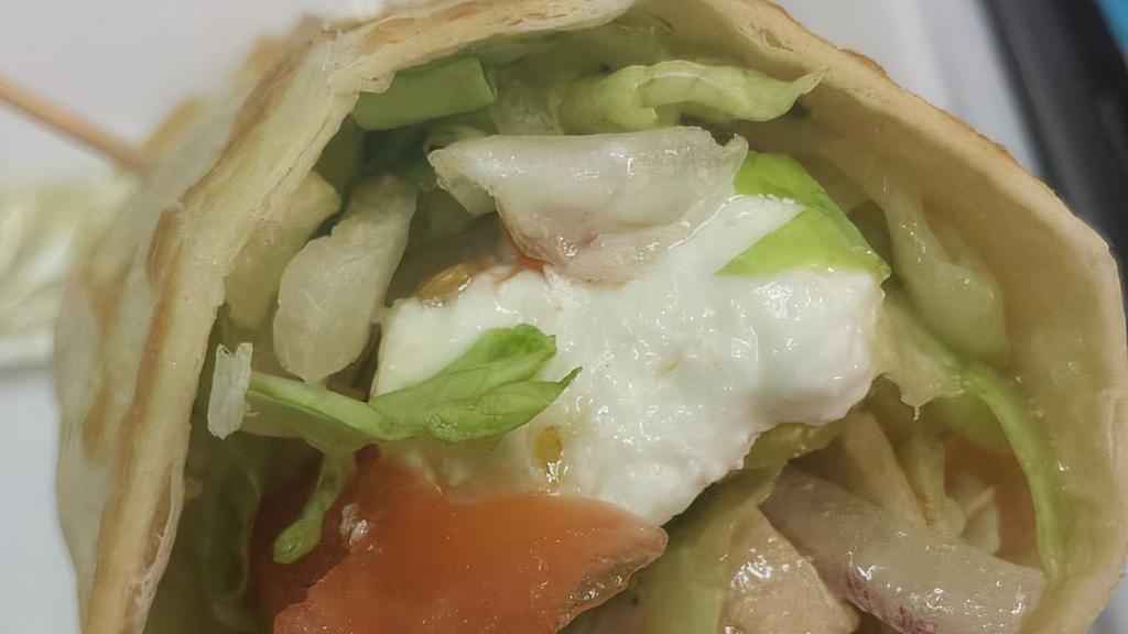 Chicken Greek Wrap · Chicken, lettuce, tomatoes, banana peppers, cucumber, bell pepper, red onion, feta, Greek dressing.