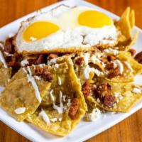 Chilaquiles · Sauteed tortilla chips with your choice of Red or Green sauce. 2 Eggs your way topped off wi...