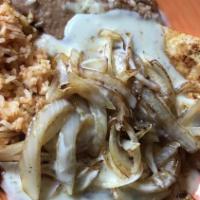 Chicken Yolanda · Grilled chicken breast topped with sted onions and queso. Served with rice, beans, and torti...