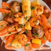 Large Boil · 1 1/2 pound of crab clusters, shrimps, andouille sausages, potatoes, and corn