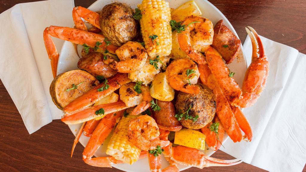 Large Boil · 1 1/2 pound of crab clusters, shrimps, andouille sausages, potatoes, and corn