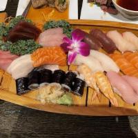 Love Boat For 2 · 16 pieces sashimi, 12 pieces sushi, 1 dragon roll, 1 California roll, 1 tuna roll.