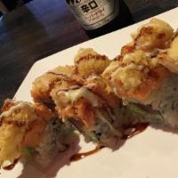 Jim Bean Roll · Tuna and avocado inside, spicy yellowtail and shrimp tempura on top with eel sauce and wasab...