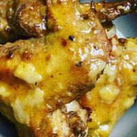 Garlic & Parmesan Wings · Roasted to perfection and topped with rich garlic Parmesan sauce.