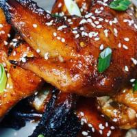 Thai Style Wings · Marinated and topped with spicy Thai BBQ sauce.