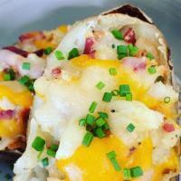 Loaded Potato Skins · Richard's special bacon, truffle and chives potato skins.