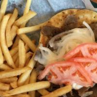 Gyro Sandwich · Served with onions, tomatoes, and Grecian sauce.