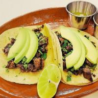 Tacos · Choice of steak, chicken, pastor or ground beef.