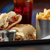 Steak Dip · Steak, Swiss cheese, horseradish sauce, au jus, grilled peppers, onions, french roll.