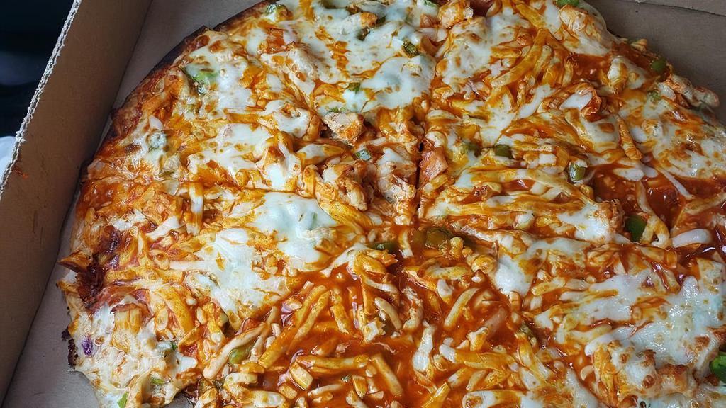 Buffalo Chicken Pizza (Small) · Marinara base with crispy buffalo chicken, green peppers, onions, crisscrossed with our wing sauce. Try it with a ranch base for a burst of flavor.