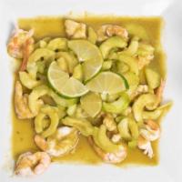 Aguachile · Marinated Shrimp in a lime and hot serrano juice, Served with sliced cucumbers and red onion...