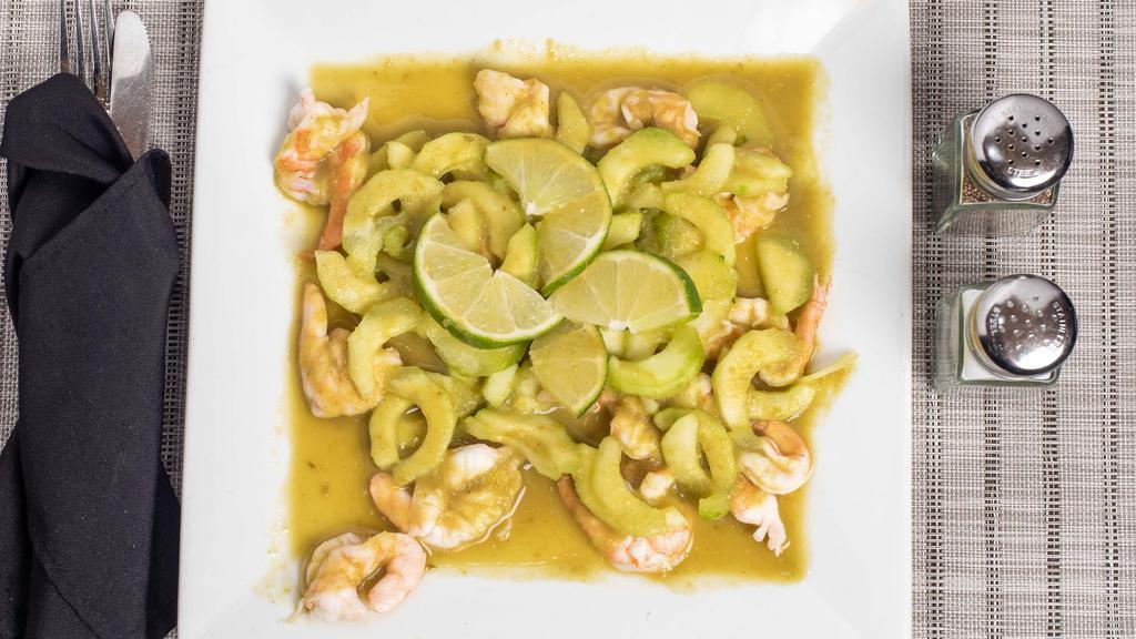 Aguachile · Marinated Shrimp in a lime and hot serrano juice, Served with sliced cucumbers and red onions. Served chilled.