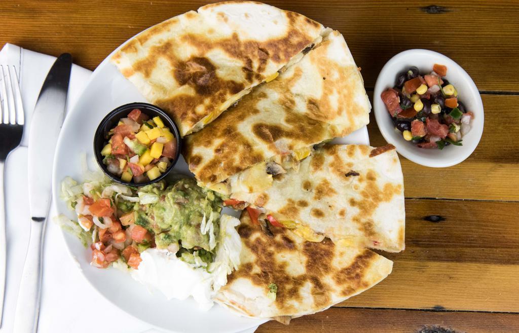 Veggie Quesadilla · Giant tortilla filled with a ton of cheese, folded and grilled with fajita peppers, mushrooms, and fajita onions. Served with holy guacamole, sour cream, lettuce, and pico de gallo on the side.