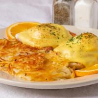 Classic Eggs Benedict · Poached Eggs atop Ham on Toasted English Muffin with Savory Hollandaise Sauce and Hash Browns