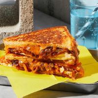 The Bbq Chicken · Melted American and Pepper-Jack cheese with chicken, barbecue sauce and caramelized onions g...