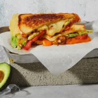 The Fancy · Melted American and Swiss cheeses with caramelized onions, tomato, avocado and mayonnaise gr...