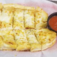 Garlic Cheese Bread · Italian bread covered in garlic butter & provolone cheese & baked until golden brown. Served...
