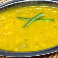 Kik Alicha (Side)- Yellow Peas, Onions, Garlic And Jalapenos · Split yellow peas stewed with onions, garlic and seeded jalapeños