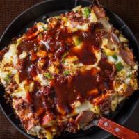 The Samoan · BBQ sauce, Canadian bacon, bacon, green peppers, onions, pineapple and a blend of cheeses.