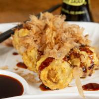 Takoyaki · 5 pcs. of japanese fried octopus ball w. Takoyaki sauce, mayo & bonito flakes.