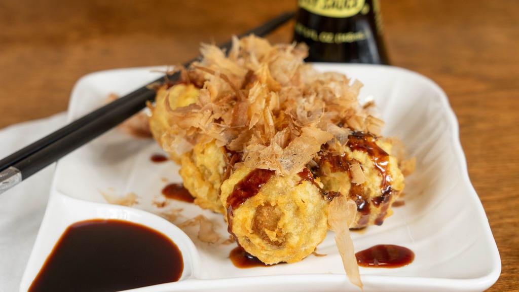 Takoyaki · 5 pcs. of japanese fried octopus ball w. Takoyaki sauce, mayo & bonito flakes.