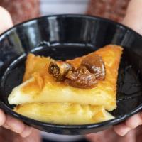 Saganaki · melted vlachotiri cheese with peppered figs & honey